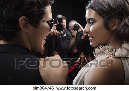 Celebrities posing on red carpet View Large Photo Image Stock Photograph - Celebrities posing on red carpet. Fotosearch