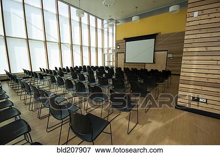 Chairs and projection screen in empty room View Large Photo Image Stock Photo - Chairs and projection screen in empty room. Fotosearch