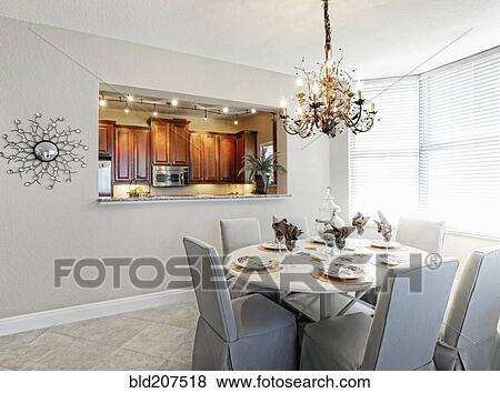 Chandelier over dining room table View Large Photo Image Stock Photo - Chandelier over dining room table. Fotosearch