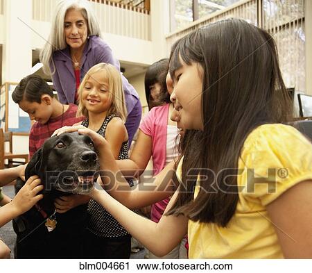 Children petting dog View Large Photo Image Stock Image - Children petting dog. Fotosearch