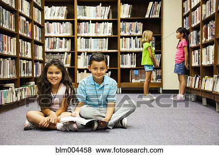 Children sitting on library floor View Large Photo Image Stock Photo - Children sitting on library floor. Fotosearch