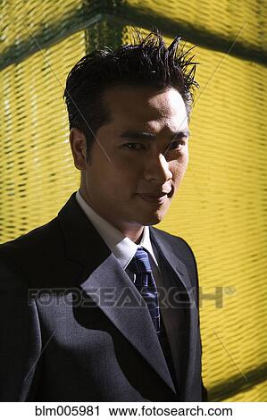 Chinese businessman smiling View Large Photo Image Stock Image - Chinese businessman smiling. Fotosearch