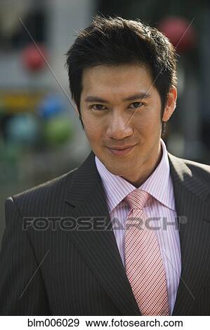 Stock Photo - Chinese businessman smiling. Fotosearch