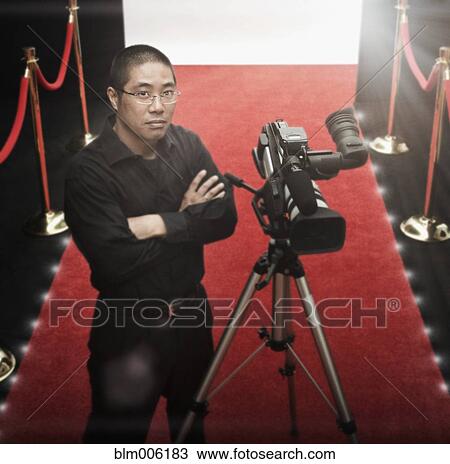 Chinese cameraman on red carpet with camera View Large Photo Image Stock Image - Chinese cameraman on red carpet with camera. Fotosearch