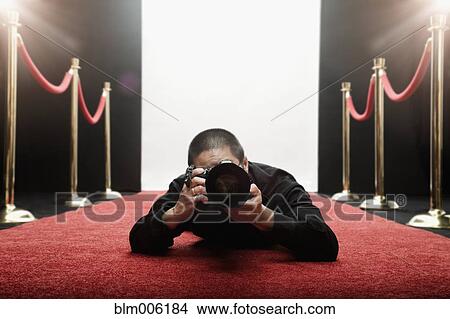 Chinese photographer laying on red carpet View Large Photo Image Picture - Chinese photographer laying on red carpet. Fotosearch