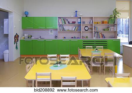 Stock Image - Classroom, activity room with furniture, tables and chairs. Fotosearch