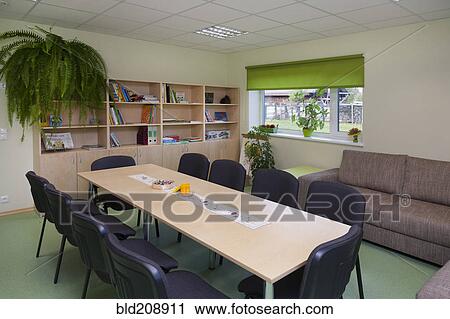 Stock Image - Classroom, activity room with furniture, tables and chairs. Fotosearch