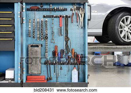 Stock Image - Close-up of a variety of tools on a blue board. Fotosearch