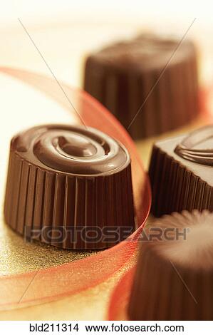 Picture - Close up of assorted chocolates. Fotosearch