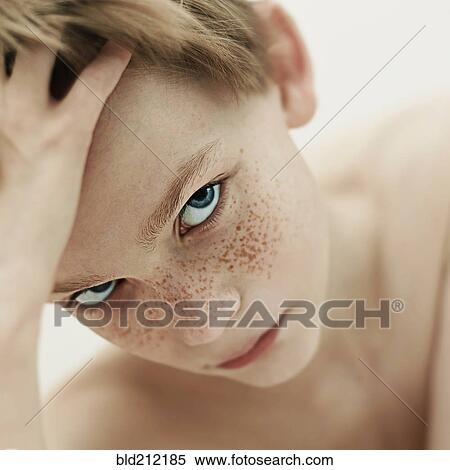 Stock Photography - Close up of Caucasian boy's face. Fotosearch