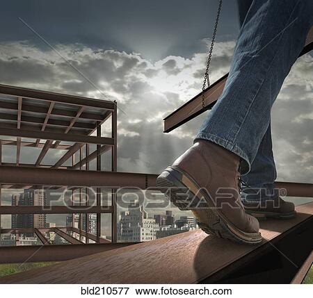 Stock Photo - Close up of construction worker on infrastructure. Fotosearch