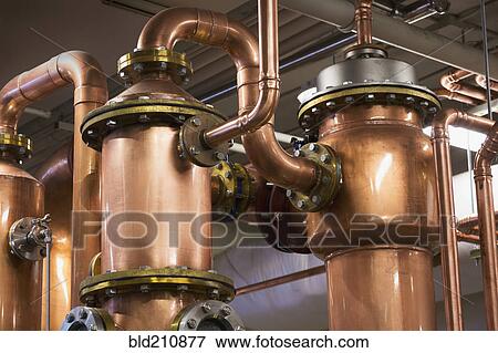 Close up of copper stills in distillery View Large Photo Image Stock Photo - Close up of copper stills in distillery. Fotosearch