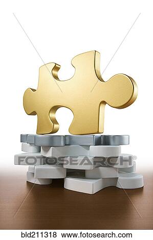 Close up of gold piece of jigsaw puzzle View Large Photo Image Stock Photo - Close up of gold piece of jigsaw puzzle. Fotosearch