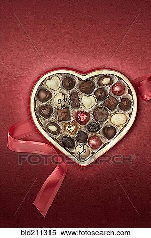 Stock Photography - Close up of heart-shaped box of chocolates. Fotosearch