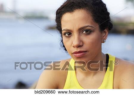 Stock Image - Close up of mixed race woman's face. Fotosearch