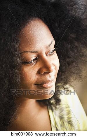 Stock Photo - Close up of smiling mixed race woman. Fotosearch