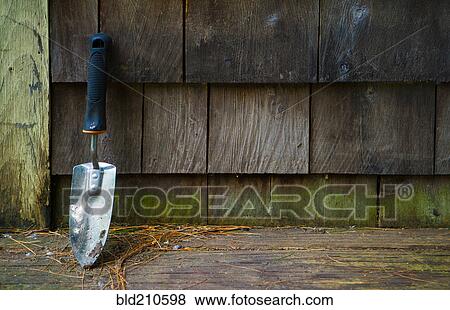 Close up of trowel outside house View Large Photo Image Stock Photo - Close up of trowel outside house. Fotosearch