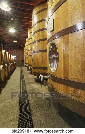 Close up of wine barrels in cellar View Large Photo Image Stock Photo - Close up of wine barrels in cellar. Fotosearch