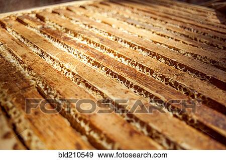Stock Photo - Close up of wooden bee hives. Fotosearch
