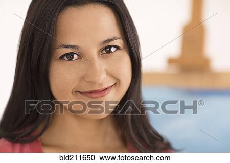 Stock Image - Close up portrait of smiling woman. Fotosearch