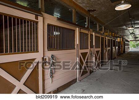 Stock Photo - Closed stables in barn. Fotosearch