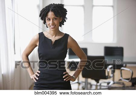 Confident mixed race businesswoman with hands on hips View Large Photo Image Stock Photography - Confident mixed race businesswoman with hands on hips. Fotosearch