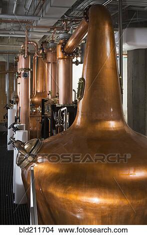 Picture - Copper stills in distillery. Fotosearch