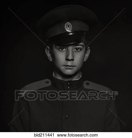 Stock Image - Cossack soldier boy wearing uniform. Fotosearch