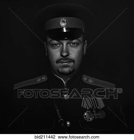 Stock Image - Cossack soldier wearing uniform. Fotosearch