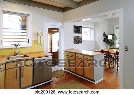 Stock Photograph - Counter top and cabinets in modern craftsman kitchen. Fotosearch