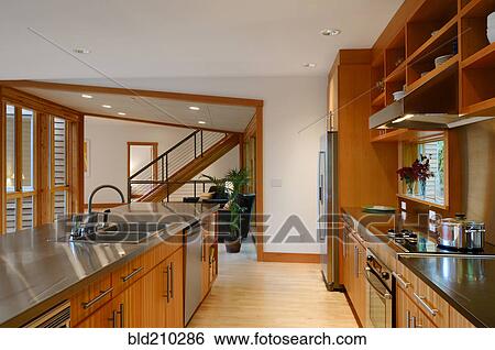 Stock Photograph - Counter tops, stove and sink in kitchen. Fotosearch
