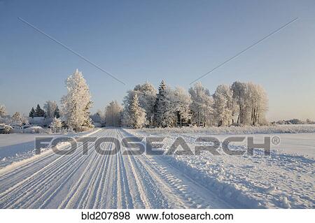 Stock Photo - Country Road Covered in Snow. Fotosearch