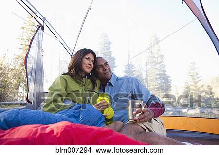 Couple camping and cuddling in tent View Large Photo Image Picture - Couple camping and cuddling in tent. Fotosearch