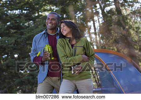 Stock Photograph - Couple camping. Fotosearch