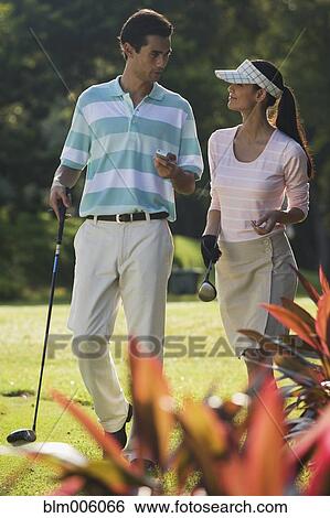 Stock Photograph - Couple golfing together. Fotosearch