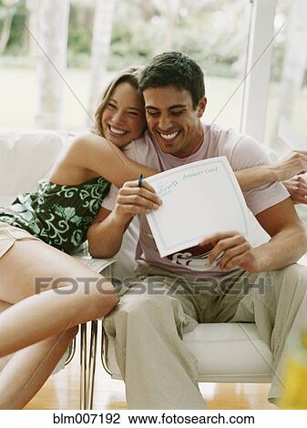 Couple hugging and holding certificate View Large Photo Image Stock Image - Couple hugging and holding certificate. Fotosearch