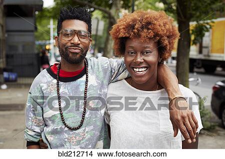 Picture - Couple hugging on city street. Fotosearch