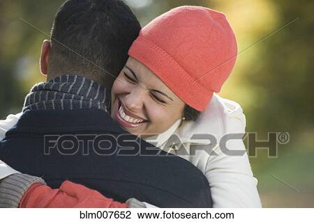 Couple hugging outdoors View Large Photo Image Stock Image - Couple hugging outdoors. Fotosearch