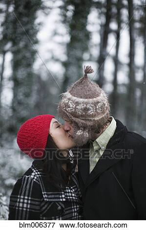 Stock Photo - Couple kissing outdoors. Fotosearch