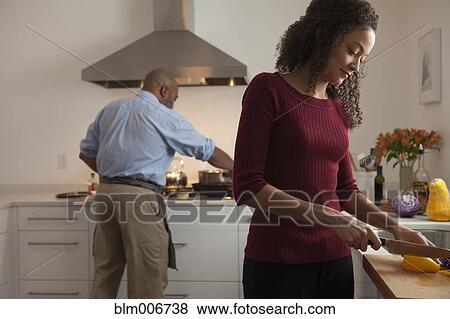 Couple making dinner together View Large Photo Image Stock Photo - Couple making dinner together. Fotosearch