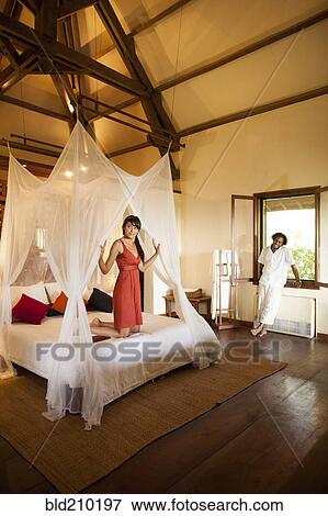 Stock Photo - Couple relaxing in hotel room. Fotosearch