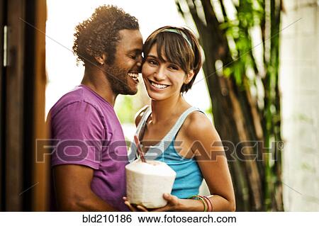 Stock Photograph - Couple relaxing together outdoors. Fotosearch