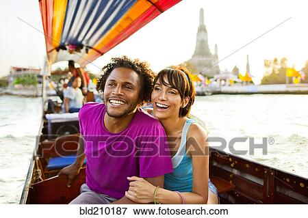 Stock Photo - Couple riding gondola, Bangkok, Bangkok, Thailand. Fotosearch