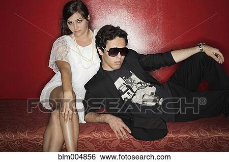 Stock Photograph - Couple sitting in nightclub. Fotosearch