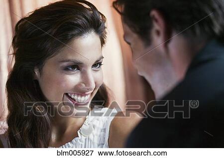 Couple smiling at each other View Large Photo Image Stock Photo - Couple smiling at each other. Fotosearch