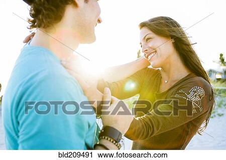 Stock Image - Couple talking outdoors. Fotosearch
