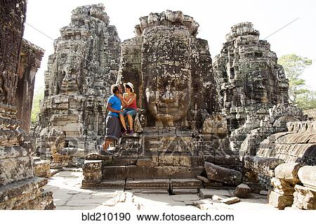 Couple visiting ancient temple, Angkor, Siem Reap, Cambodia View Large Photo Image Stock Image - Couple visiting ancient temple, Angkor, Siem Reap, Cambodia. Fotosearch