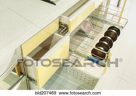 Stock Photo - Cupboard with stainless steel metal racking. Fotosearch