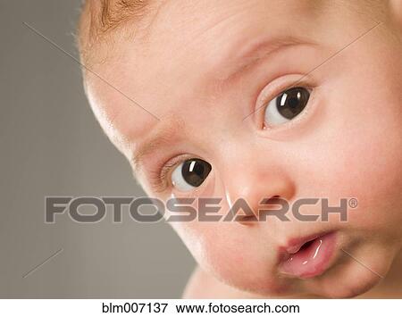 Stock Photo - Curious mixed race newborn baby. Fotosearch