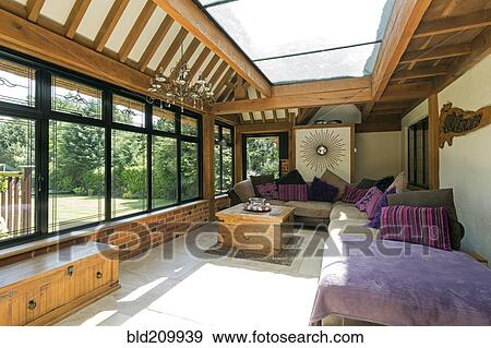 Cushioned benches in sunny conservatory View Large Photo Image Stock Photo - Cushioned benches in sunny conservatory. Fotosearch
